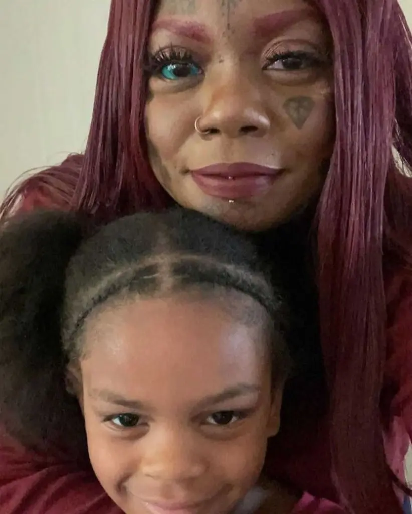 womqn tattooed with her 7 year old daughter.