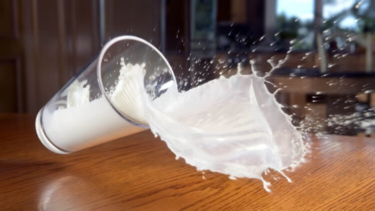 milk spilling from hands